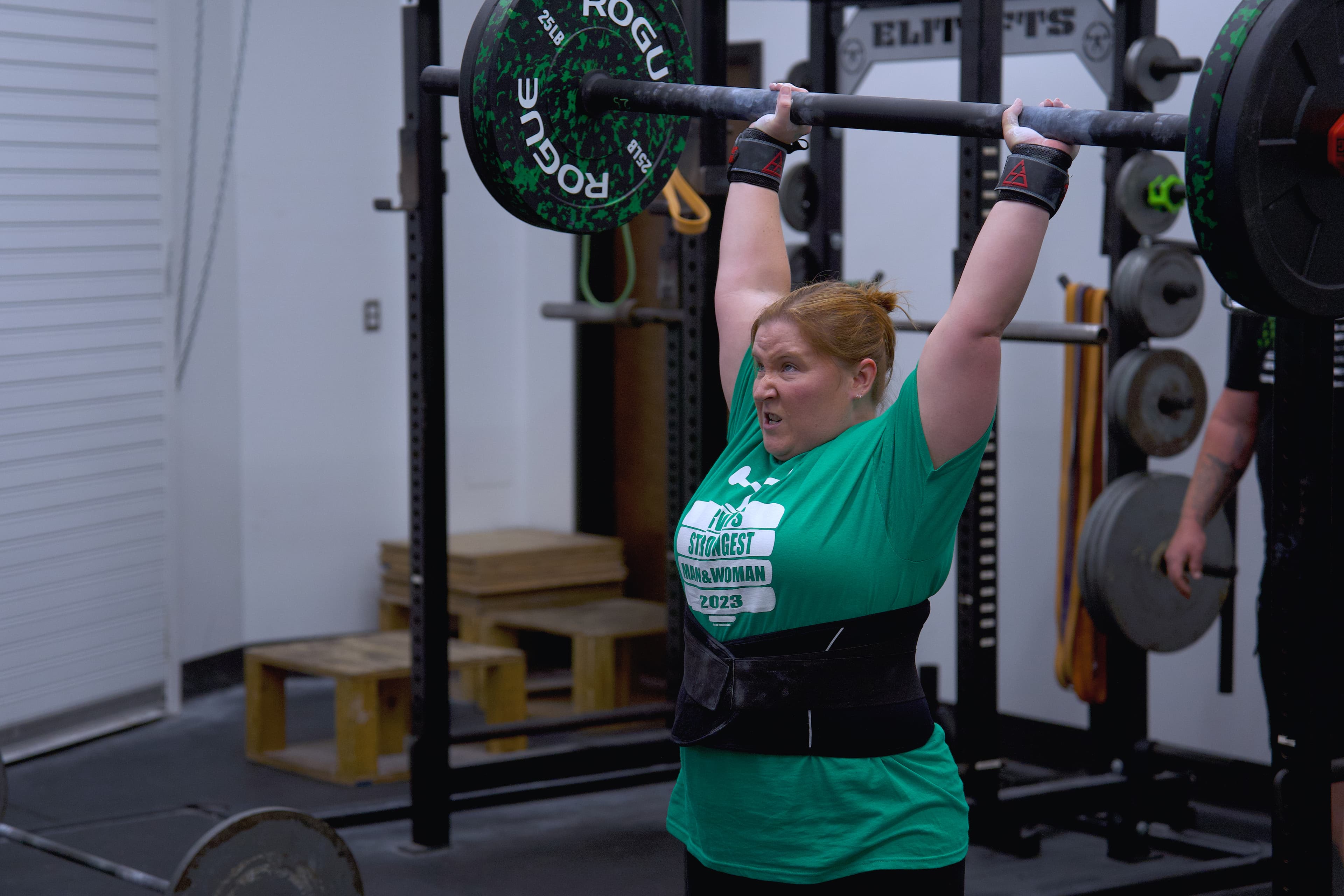 Athlete performing overhead press at X Factor Athletic Performance in Richmond VA